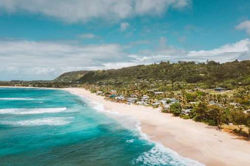 A beautiful beach with clear blue water and white sand.