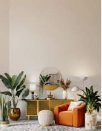 a living room filled with furniture and plants