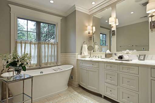 a bathroom with a bathtub and two sinks
