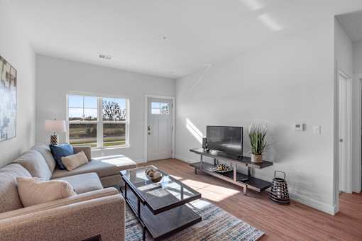 Living room area at The Landing at Hub City, WI, 53073