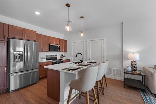 Kitchen with an island at The Landing at Hub City, Plymouth, WI
