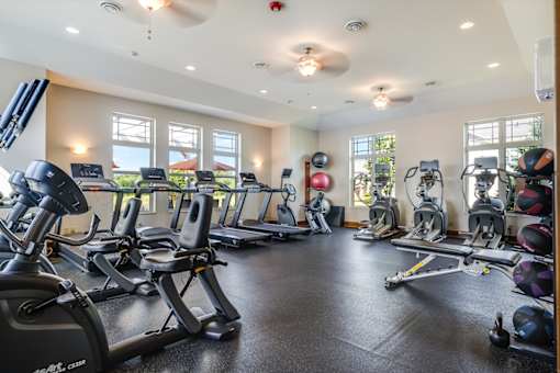 A spacious gym with a variety of exercise equipment.