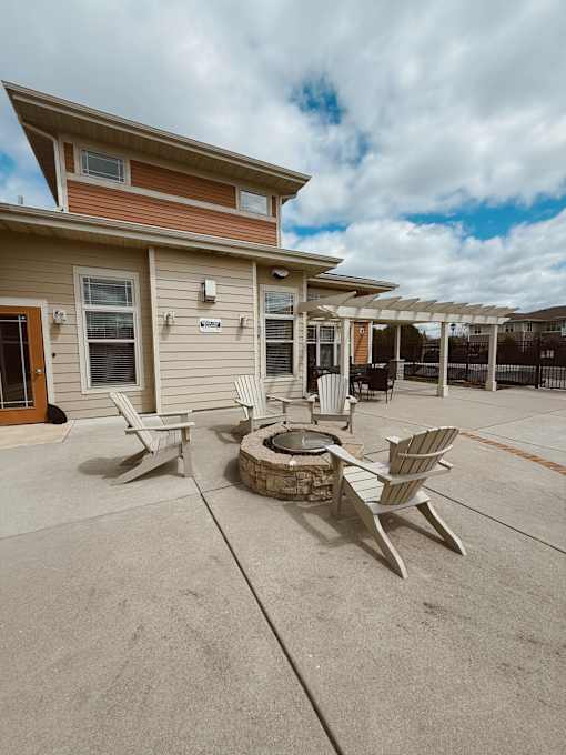 A house with a patio and chairs.