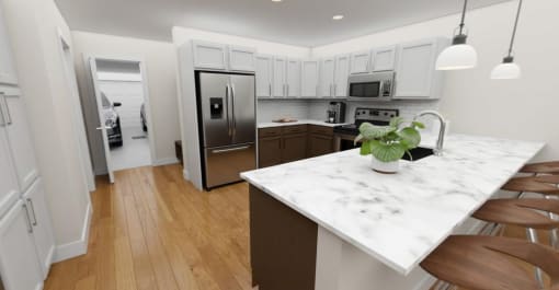 a kitchen with a marble counter top and a stainless steel refrigerator