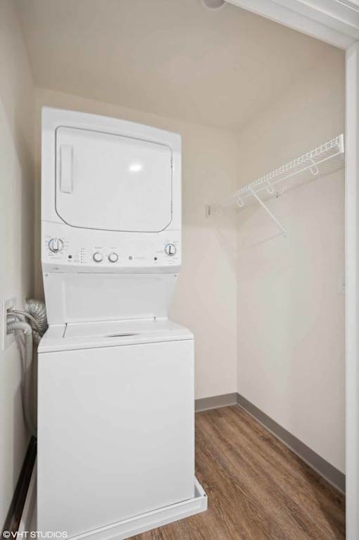 A white dishwasher is in a small kitchen.