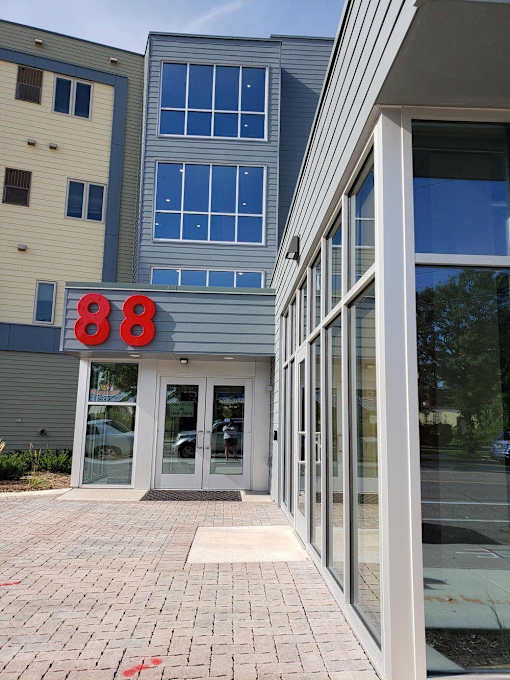 a building with a sign that reads 868 at the front of it