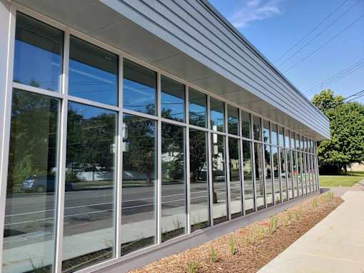 the side of a building with glass windows