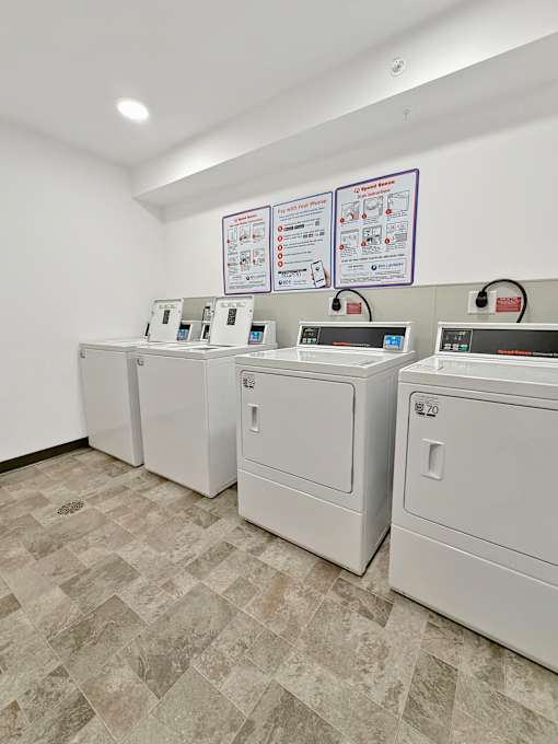 A row of washing machines in the Stryker Senior Apartments in West St. Paul laundry room..