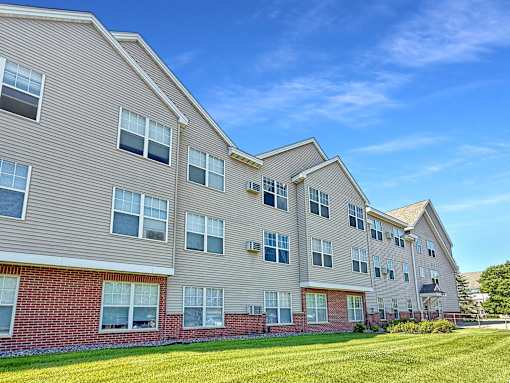 A large apartment building with multiple windows and balconies.