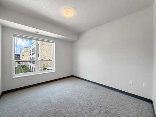 a bedroom with a large window