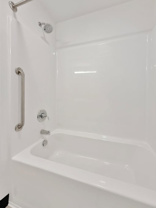 A combination bathtub and shower at Stryker Senior Apartments in West St. Paul 