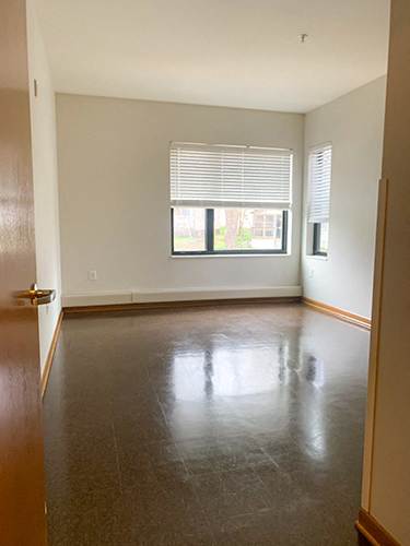 A photo of a bedroom and window with blinds half open at Gateway Lofts in North Minneapolis