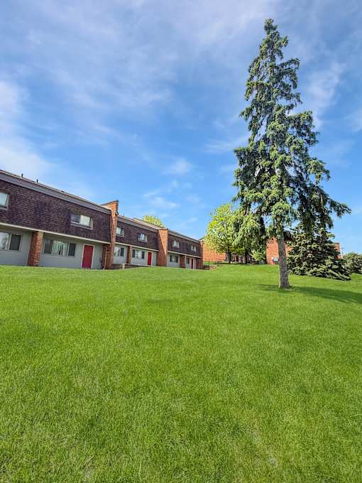 A photo of the front lawn of Liberty Plaza Townhomes