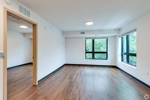 a Stryker Senior Apartments in West St. Paul living room with wood floors and a window