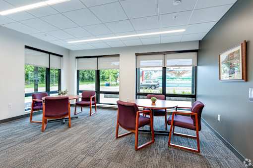 The Stryker Senior Apartments in West St paul Front Lobby and Game Roomwith tables and chairs and large windows