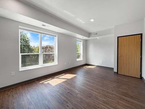 a living room with large windows