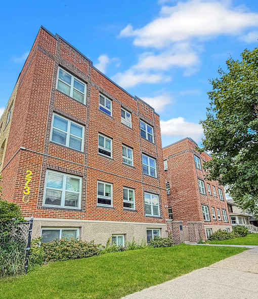 A red brick building with the number 2333 on it.