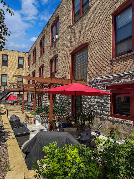 A patio and red umbrella at 653 Artists Lofts