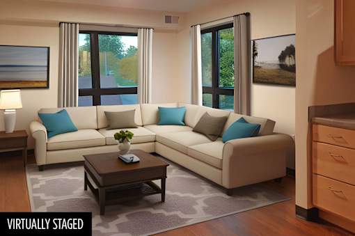 a Stryker Senior Apartments living room with a couch and a coffee table