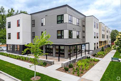 a view of a Stryker Senior Apartments in West St. Paul with a sidewalk