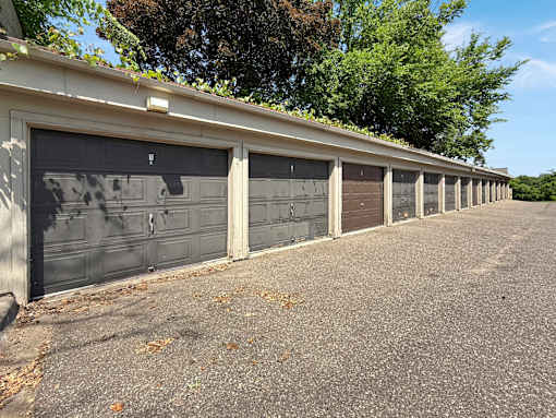 A long row of garage doors are closed.