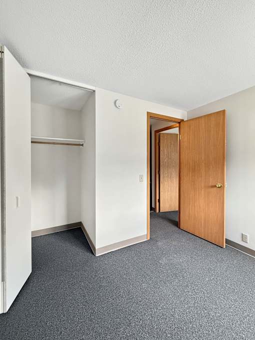 A photo of a Liberty Plaza townhome bedroom with a closet