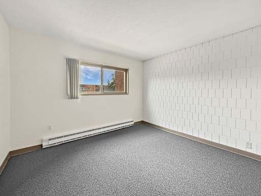 A photo of a Liberty Plaza Townhome Bedroom with  window.