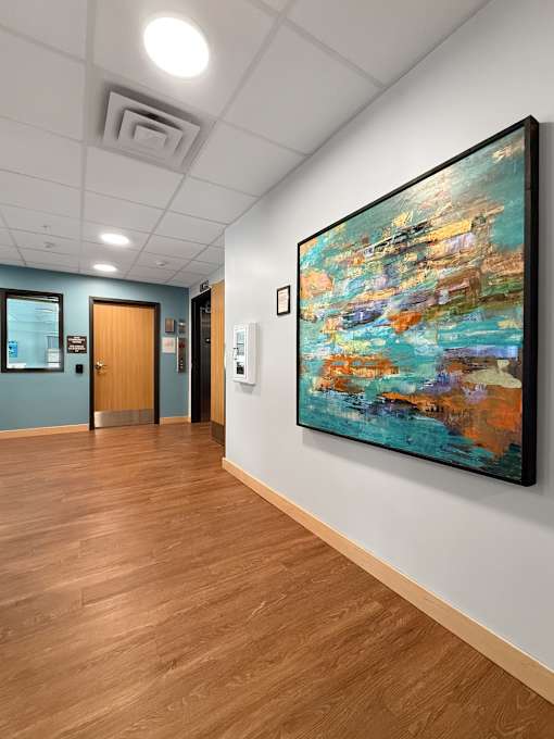 A lobby with an art print on the wall