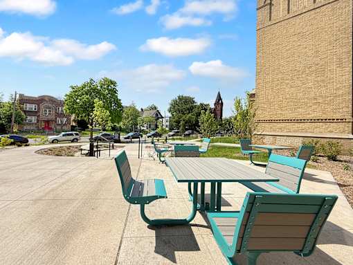 A large patio with a table and benches