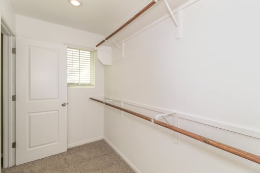 a utility room with a white door and white walls