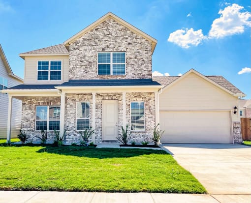 Building exterior view with pathway to entrance at The Residences at Rayzor Ranch, Denton, TX, 76207