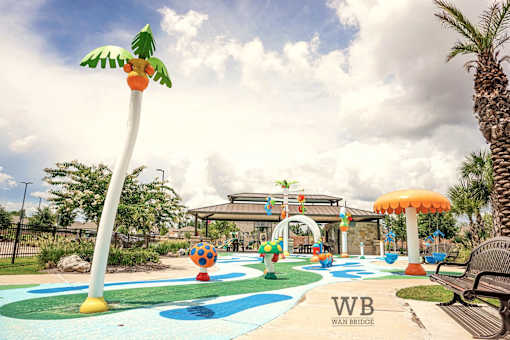 A playground with a slide and a palm tree.