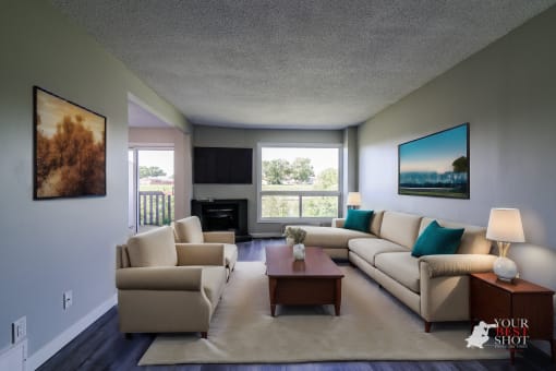 a living room with couches and a coffee table