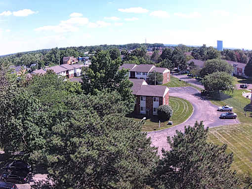 A residential area with houses and trees.