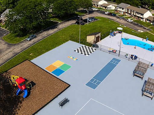 A playground with a blue surface and a checkered pattern.