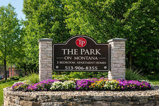A sign for The Park on Montana, a 2 bedroom apartment complex, with a phone number listed.
