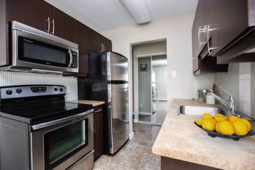 a kitchen with stainless steel appliances and a sink