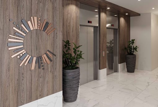 A wooden wall with a circular decoration and two potted plants.