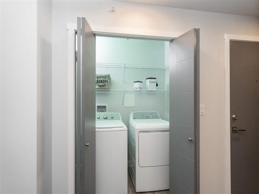 A laundry room with a washer and dryer.