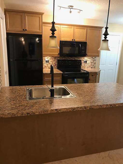 a view of the kitchen from the living room