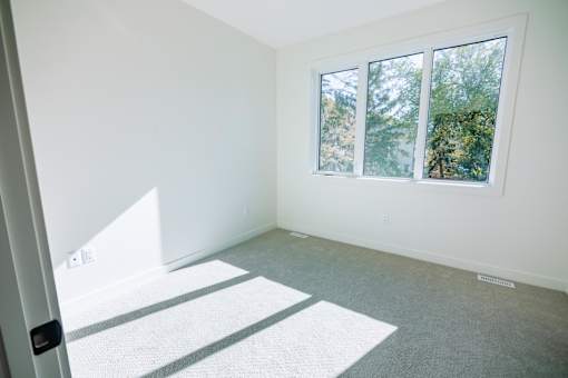 A room with a window and a door.