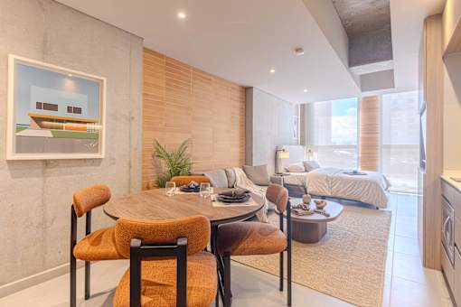 A dining area with a table and chairs in a modern room.