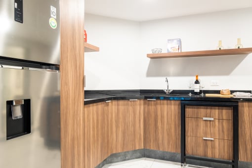 a kitchen with wooden cabinets and stainless steel appliances