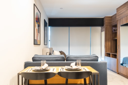 a living room with a couch and two tables
