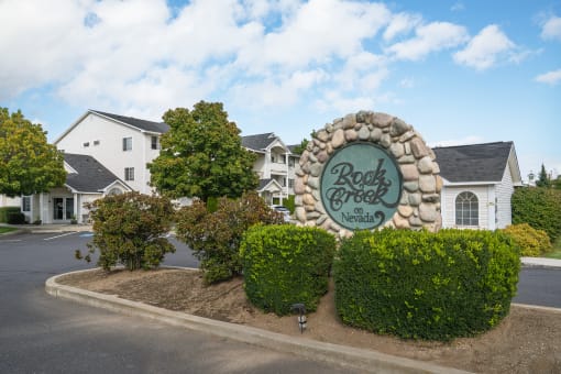 the sign estates with houses in the background