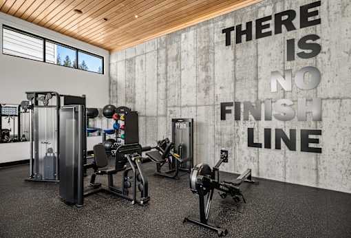 A gym with a wall that says "There is no finish line".