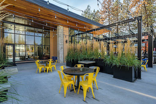 A patio with a table and chairs.