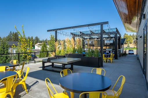 A patio with a table and chairs is shown.
