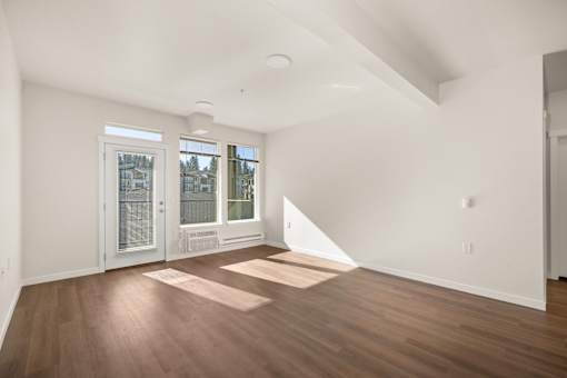 A room with wooden floors and white walls.