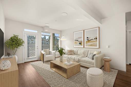 A living room with a couch, a coffee table, and a television.